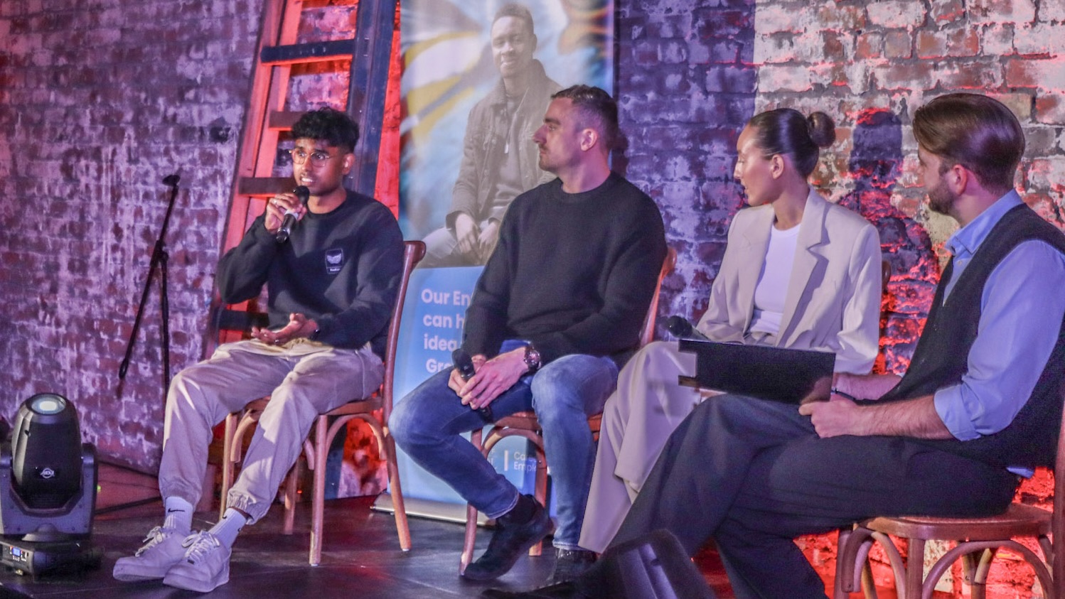 Me speaking on stage at Design Your Future 2024